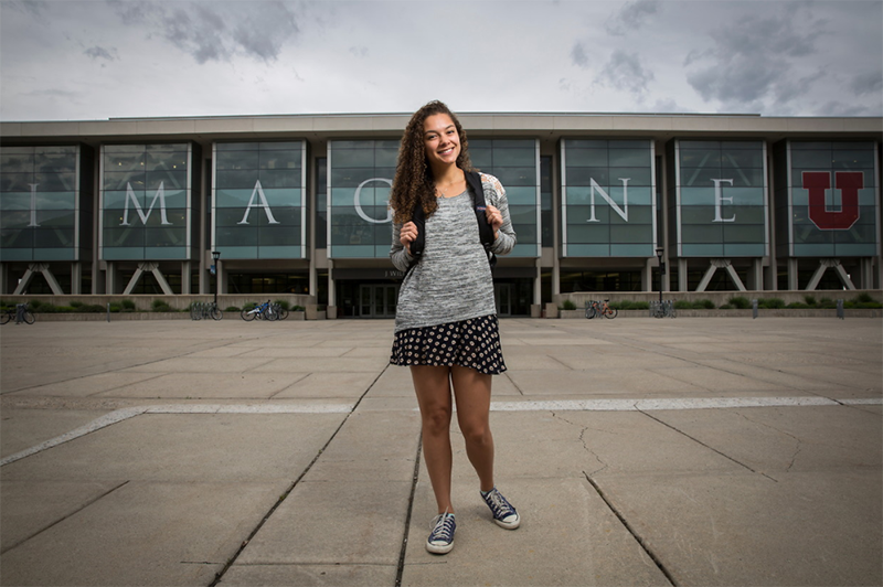 Student in front of J. Willard Marriott Library